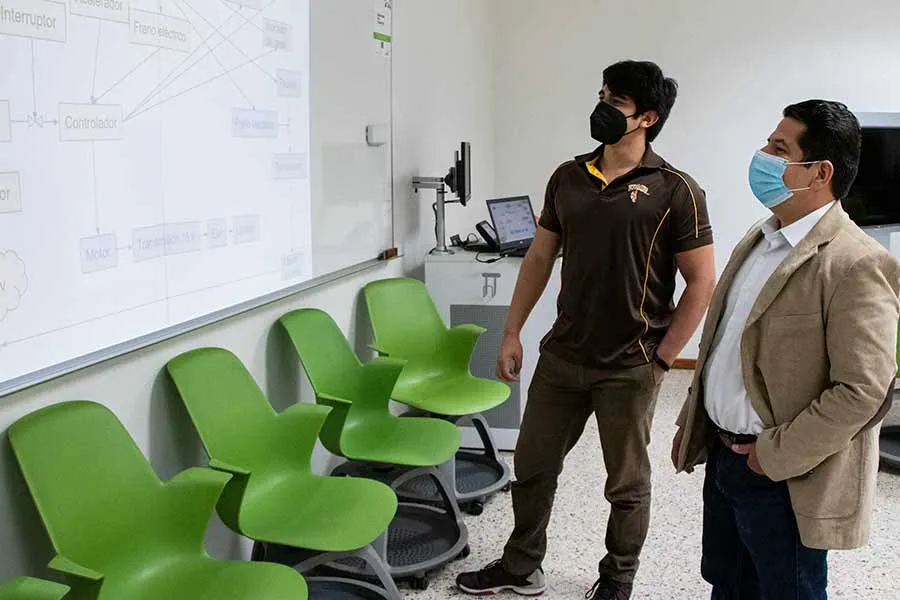 Christian Barush con un profesor