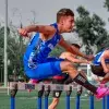 Foto del equipo de atletismo de los Borregos de Chihuahua en acción durante la competencia nacional